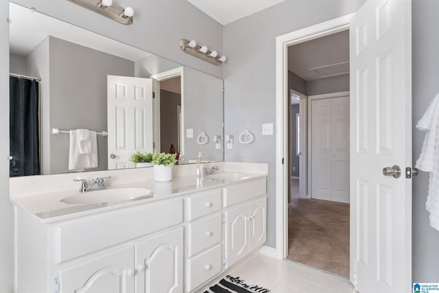 bathroom with tile patterned floors and vanity