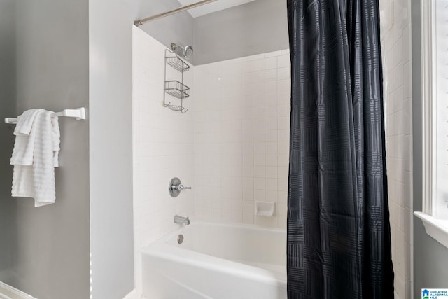 bathroom with shower / tub combo with curtain