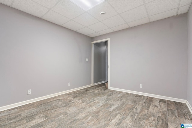 spare room with wood-type flooring