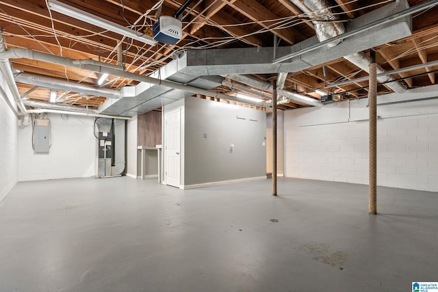 basement with electric panel and heating unit