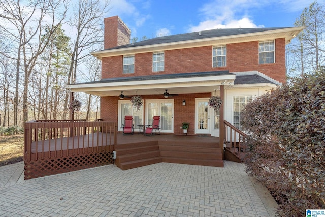 exterior space featuring french doors, ceiling fan, and a wooden deck