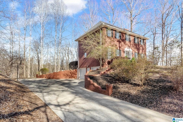 view of property exterior with a garage