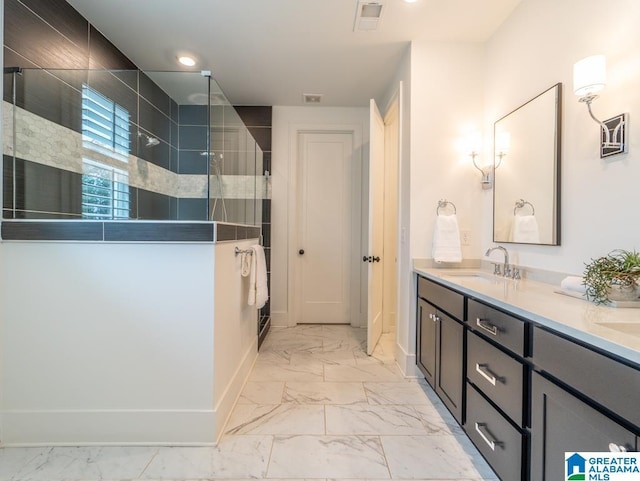 bathroom featuring vanity and a shower