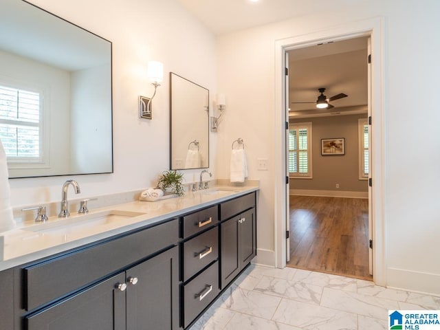 bathroom with plenty of natural light, ceiling fan, and vanity