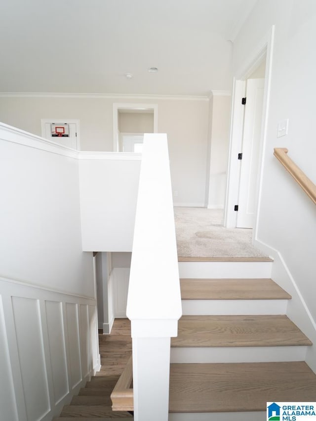 staircase with ornamental molding