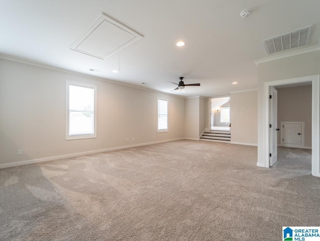 carpeted empty room featuring ceiling fan and ornamental molding