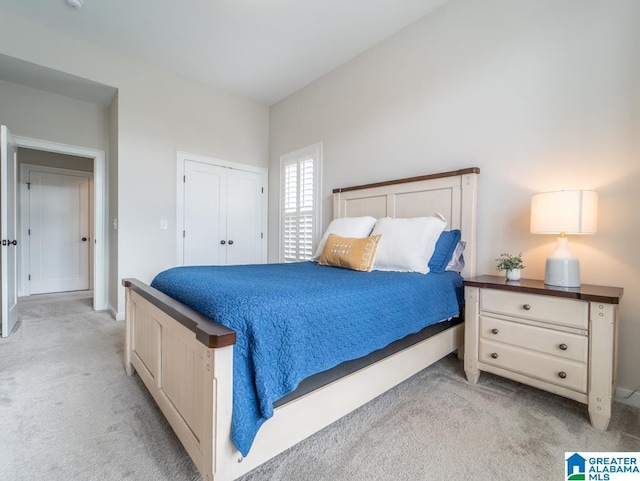 bedroom featuring light colored carpet