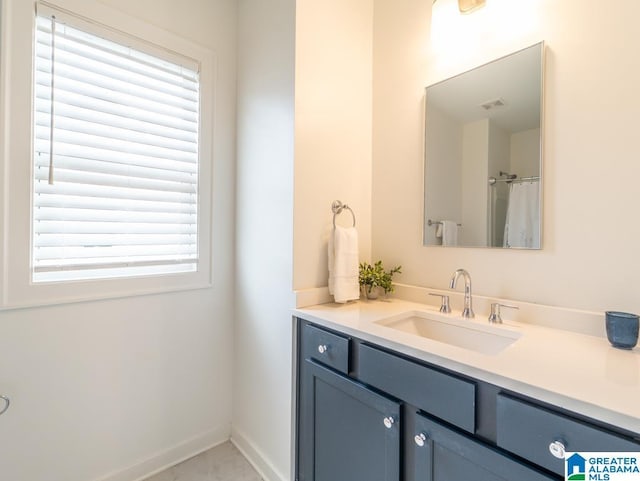 bathroom featuring vanity and a healthy amount of sunlight