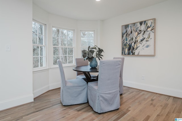 dining space featuring light wood-type flooring