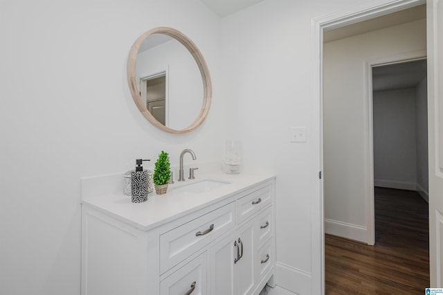 bathroom featuring hardwood / wood-style floors and vanity