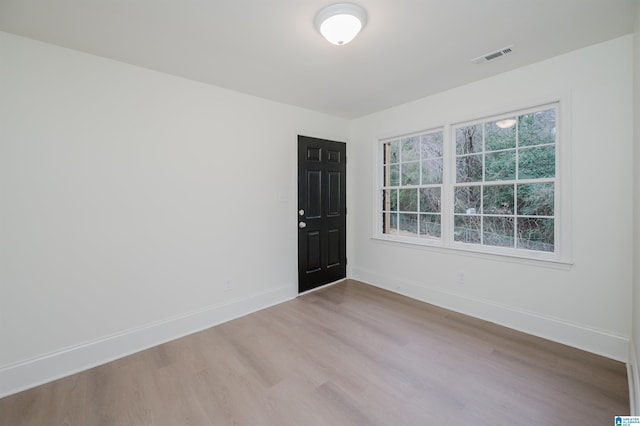 unfurnished room featuring light hardwood / wood-style floors