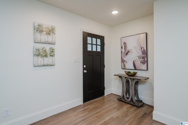 entryway with light hardwood / wood-style flooring