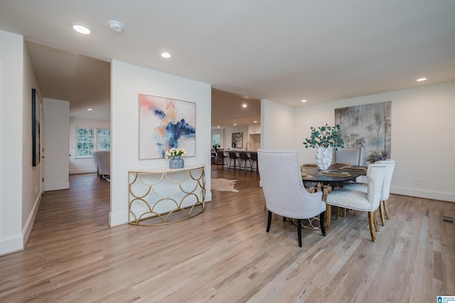 dining room with light wood-type flooring