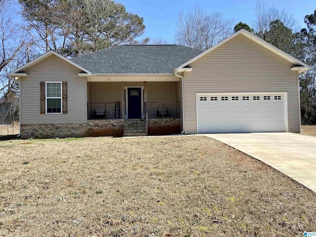 ranch-style home with a garage, covered porch, and a front lawn