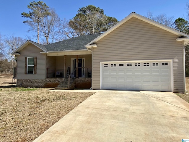 ranch-style house with covered porch and a garage