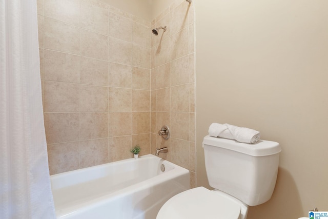 bathroom with shower / bath combo and toilet