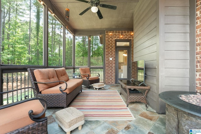 sunroom / solarium with ceiling fan and wooden ceiling