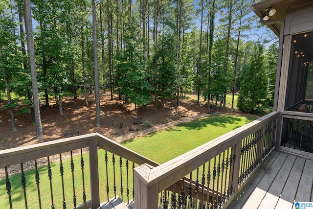 wooden terrace with a yard