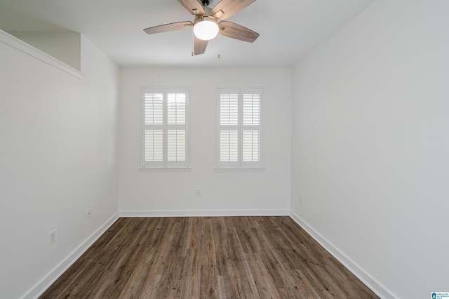 unfurnished room with ceiling fan and dark hardwood / wood-style flooring