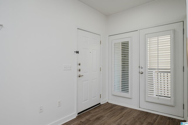 foyer featuring dark hardwood / wood-style flooring and french doors