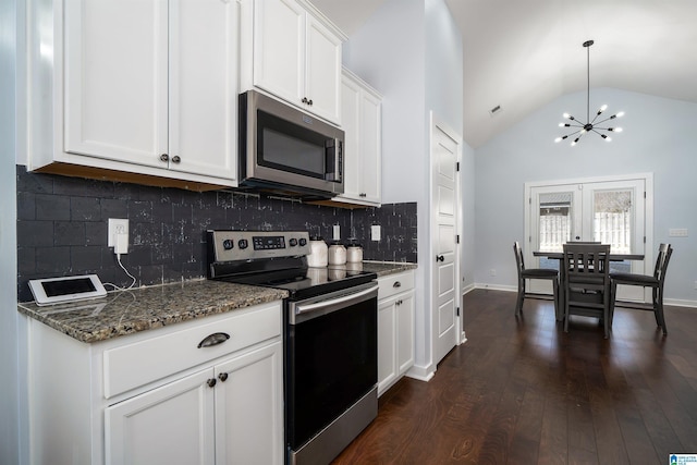 kitchen featuring dark wood-type flooring, high vaulted ceiling, dark stone counters, white cabinets, and stainless steel appliances