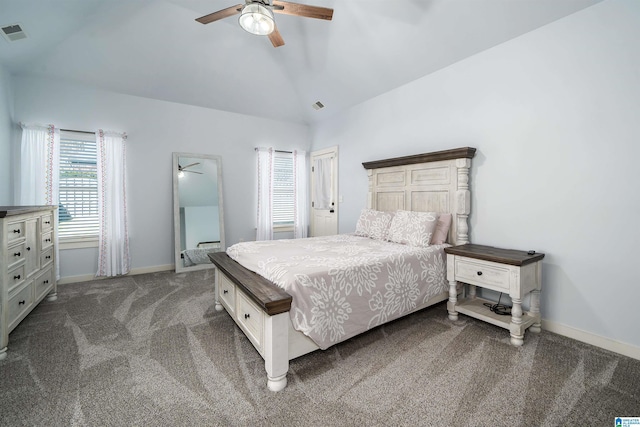 bedroom with dark colored carpet, ceiling fan, and vaulted ceiling