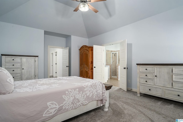 bedroom featuring carpet flooring, connected bathroom, ceiling fan, and vaulted ceiling