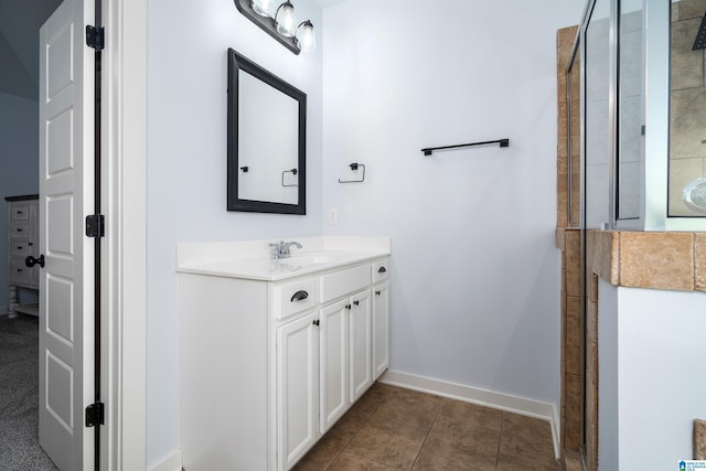 bathroom with tile patterned flooring, vanity, and an enclosed shower