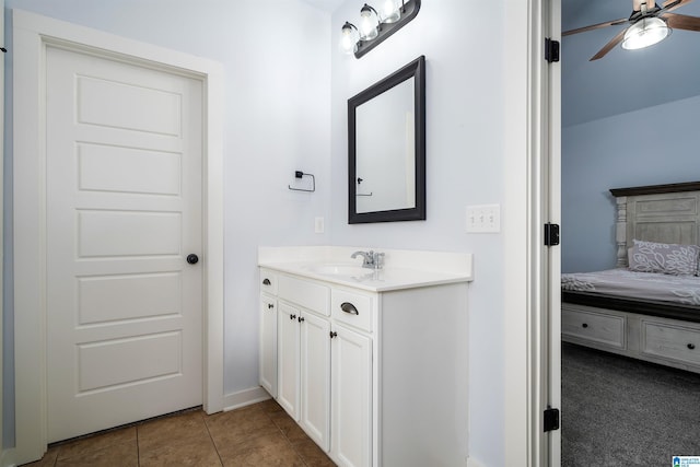 bathroom featuring tile patterned floors, vanity, and ceiling fan