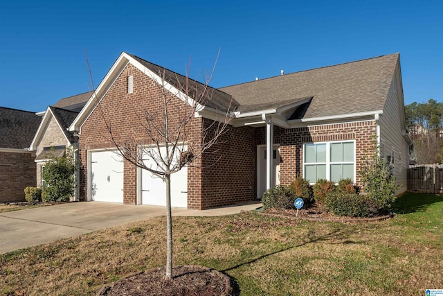 view of front facade with a front lawn and a garage