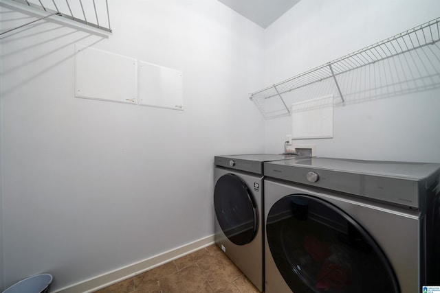 washroom with tile patterned flooring and independent washer and dryer