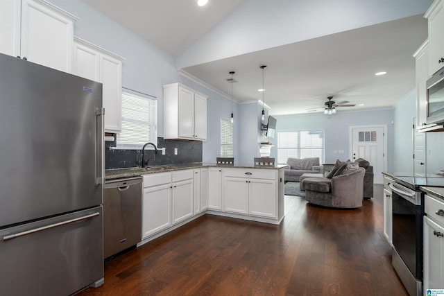 kitchen featuring kitchen peninsula, white cabinetry, ceiling fan, and appliances with stainless steel finishes