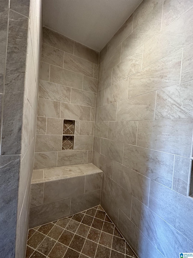 bathroom featuring tiled shower