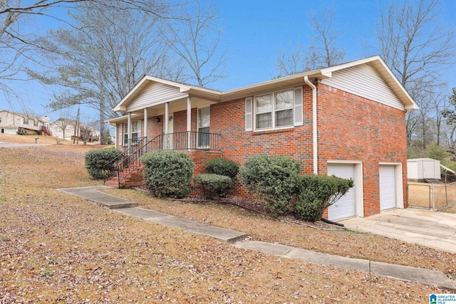 view of front of home with covered porch and a garage