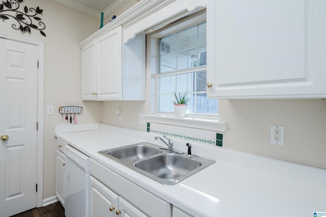 kitchen with white cabinets, sink, white dishwasher, and ornamental molding