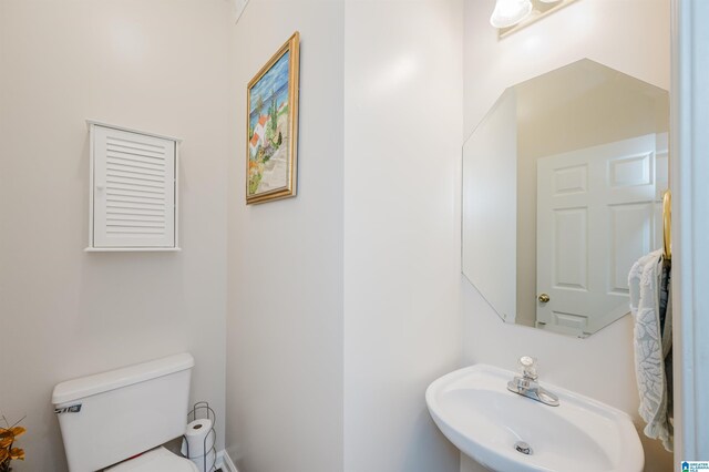 bathroom featuring sink and toilet