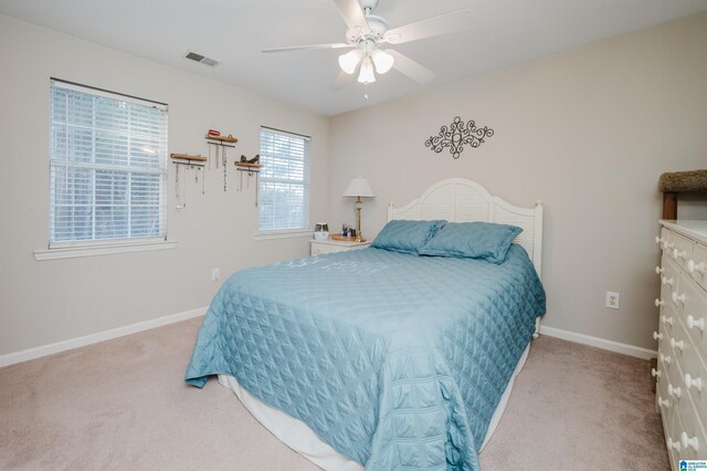 carpeted bedroom with ceiling fan