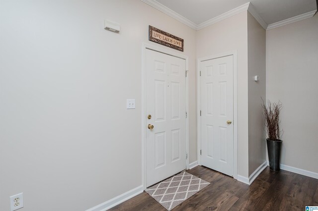 foyer with dark hardwood / wood-style floors and ornamental molding