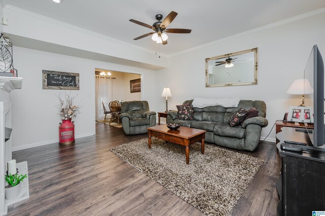 living room with ceiling fan, dark hardwood / wood-style flooring, and crown molding