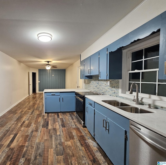 kitchen featuring backsplash, blue cabinets, sink, ceiling fan, and stainless steel appliances