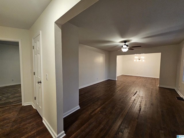 unfurnished room with ceiling fan and dark hardwood / wood-style floors