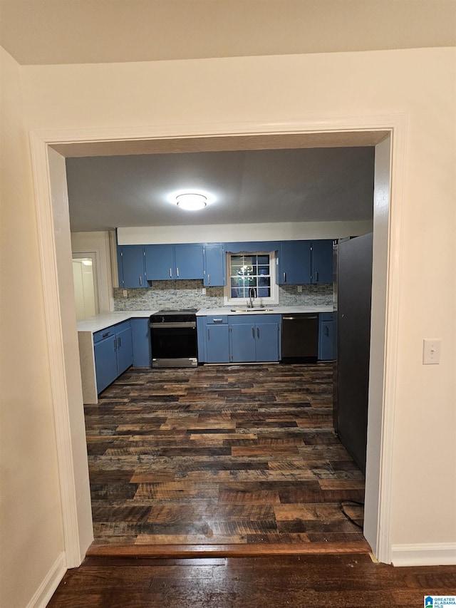 kitchen with backsplash, electric range, dark hardwood / wood-style floors, black dishwasher, and blue cabinetry