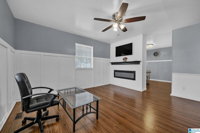 office with ceiling fan and dark hardwood / wood-style flooring