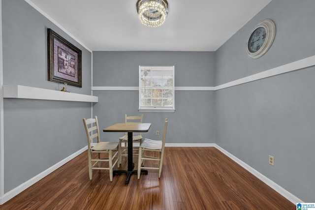 dining room with a chandelier and hardwood / wood-style flooring