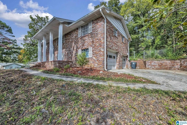 view of side of home with a garage