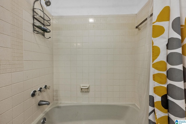 bathroom with shower / tub combo with curtain