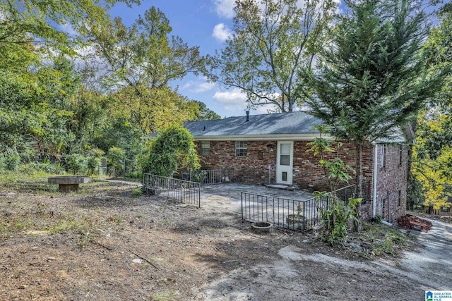 rear view of property featuring a patio