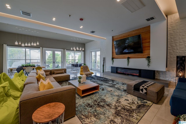 living room with light tile patterned floors and french doors