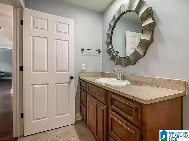 bathroom with tile patterned flooring and vanity