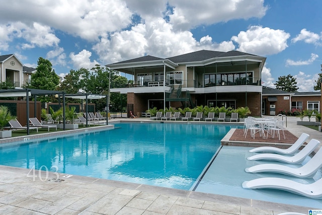 view of swimming pool with a patio